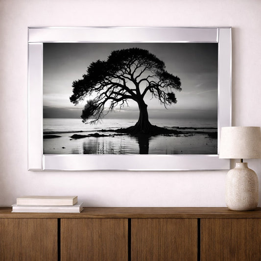 Mirrored tree stands by the lake, illuminated under the night sky