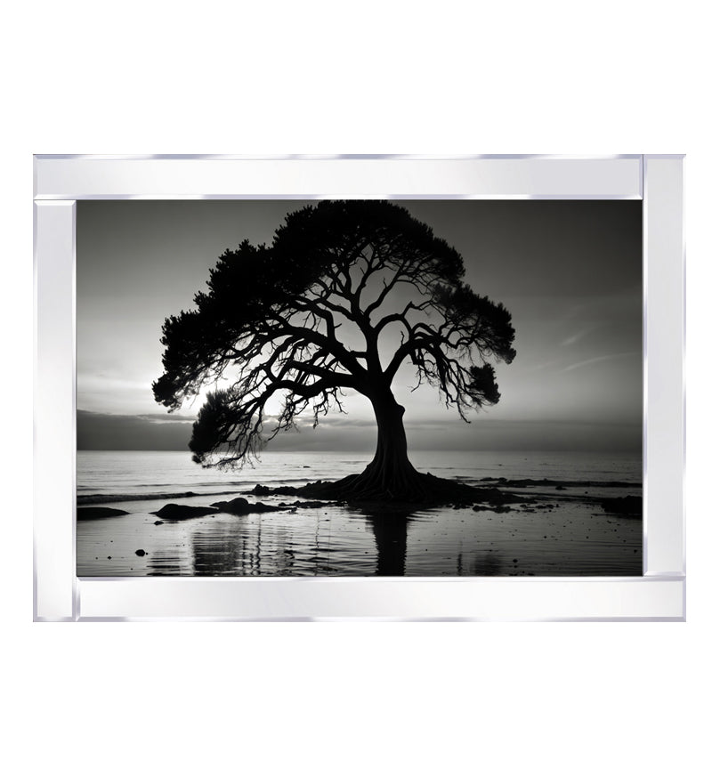 Mirrored tree stands by the lake, illuminated under the night sky