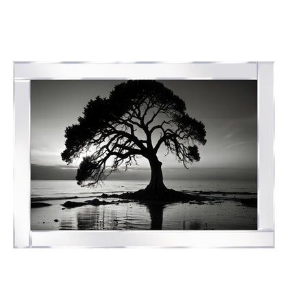 Mirrored tree stands by the lake, illuminated under the night sky